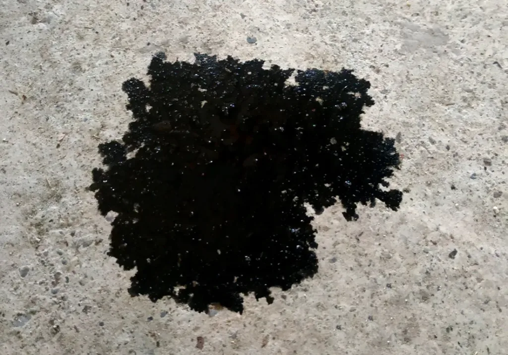 How to Get Oil and Car Fluids Off Your Garage Floor for Good